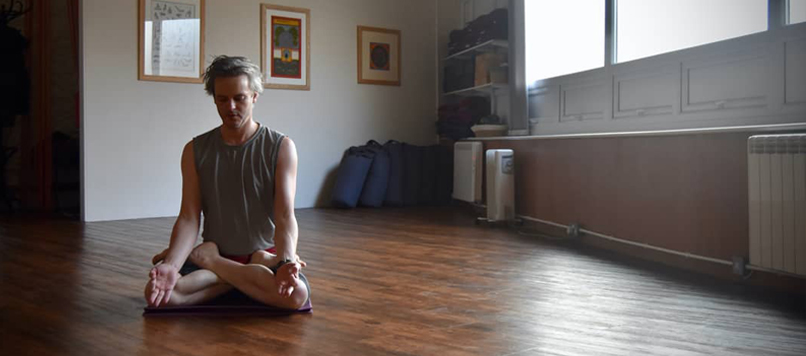 James Russell in lotus posture at Yoga Torquay