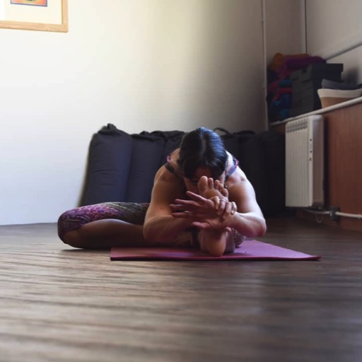 Yoga teacher in Janu Shirshasana posture